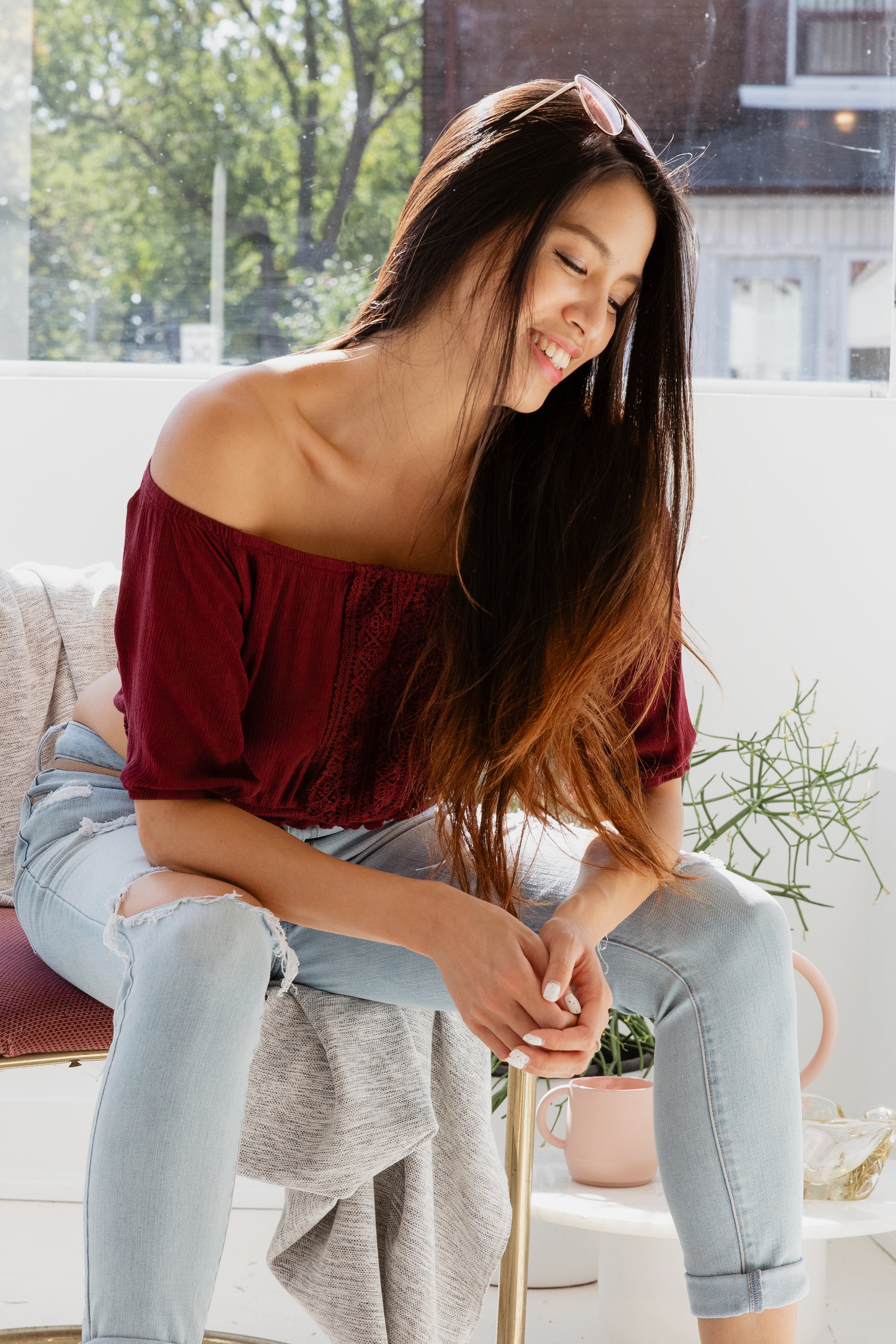 files/woman-smiles-sitting-in-sunny-window.jpg